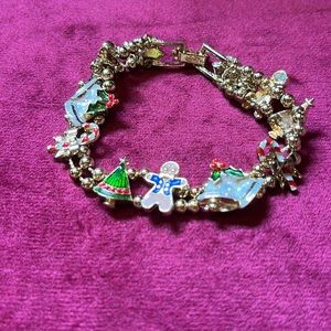 Previously Owned Avon Christmas Slide Bracelet Enamel Charms Gold Tone.